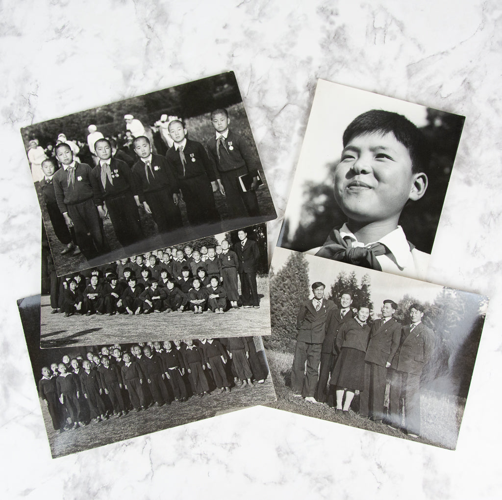 (PHOTOGRAPHY). (KOREAN WAR). Five original photographs of North Korean War Orphans in Eastern Europe.